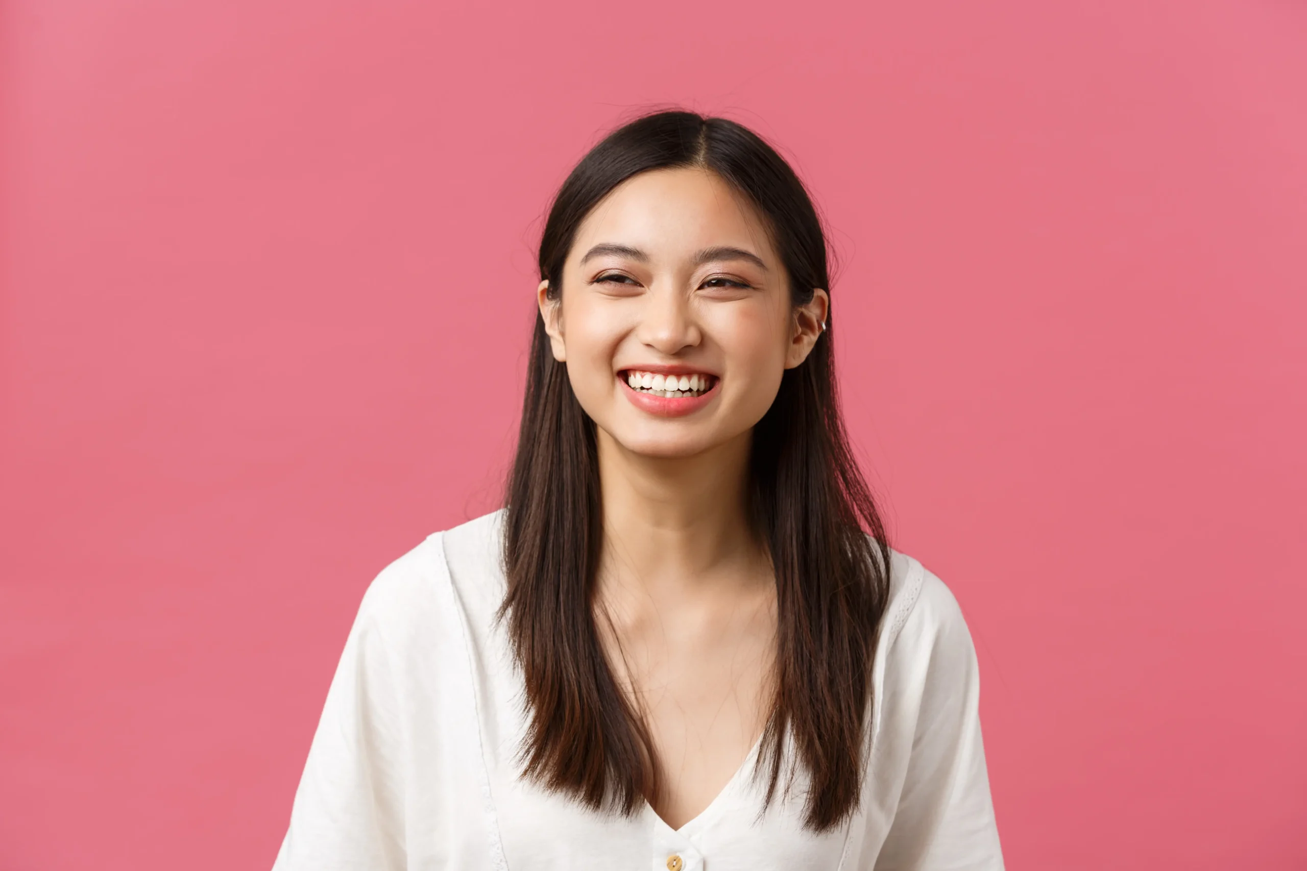 beauty-people-emotions-summer-leisure-concept-joyful-carefree-laughing-asian-woman-enjoying-summertime-standing-pink-background-smiling-lively-having-positive-mood